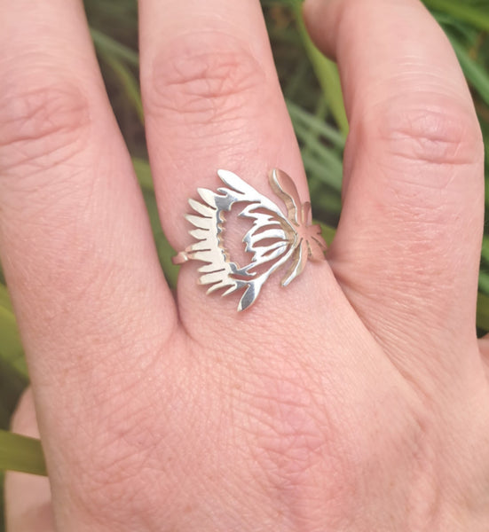 silver protea ring on finger